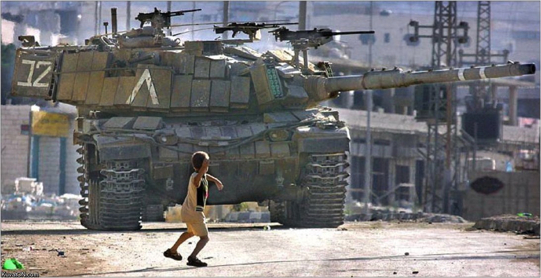 palestinian_boy_throwing_a_stone_at_israeli_tank.jpg