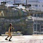 palestinian_boy_throwing_a_stone_at_israeli_tank.jpg